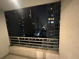 a view of a city at night from a window at Departamento Santiago Centro Factura Empresas in Santiago