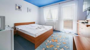 Voodi või voodid majutusasutuse Apartmány, Penzion, Wellness U zlaté rybky toas