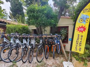 a row of bikes parked in front of a house at Camping la Croix du Sud in Saint-Tropez