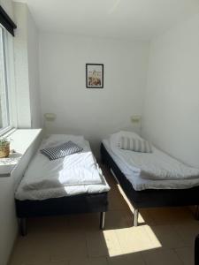 Postel nebo postele na pokoji v ubytování Guesthouse Hune