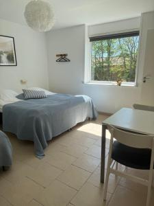 Postel nebo postele na pokoji v ubytování Guesthouse Hune