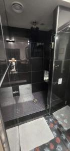 a bathroom with a shower with a glass door at Shangri-La - Near Mendenhall Glacier and Auke Bay -DISCOUNTS ON TOURS! in Mendenhaven +51 photos