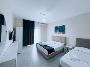 Postel nebo postele na pokoji v ubytování Molla Hotel Restorant