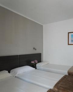Postel nebo postele na pokoji v ubytování Hotel Ram Rooms Tahiti