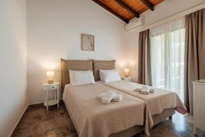 Posteľ alebo postele v izbe v ubytovaní Kalamionas Studios & Apartments