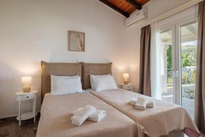 Posteľ alebo postele v izbe v ubytovaní Kalamionas Studios & Apartments