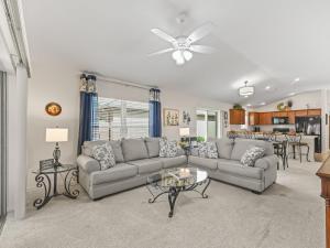 a living room with a couch and a table at 2455 Z6 Village of Desoto by REMAX Premier in The Villages