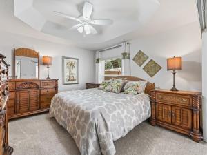 a bedroom with a bed and a ceiling fan at 2455 Z6 Village of Desoto by REMAX Premier in The Villages
