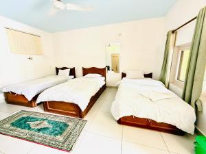 Letto o letti in una camera di Hotel Mantra and Adventure