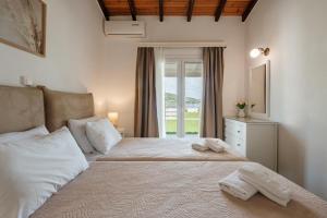 Posteľ alebo postele v izbe v ubytovaní Kalamionas Studios & Apartments