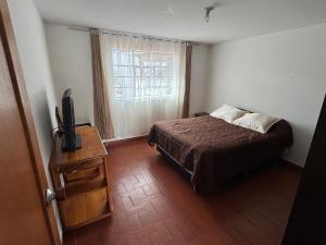 Postel nebo postele na pokoji v ubytování Omar House alojamiento en Paipa, Boyacá