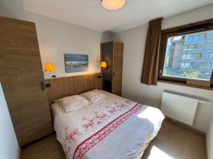 Ένα ή περισσότερα κρεβάτια σε δωμάτιο στο Appartement Neuf aux Saisies - 6 Pers, 52m², 3 Pièces, Grand Balcon, Parking Couvert - FR-1-293-241