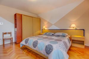 Postel nebo postele na pokoji v ubytování Apartments Petra