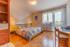 Postel nebo postele na pokoji v ubytování Apartments Petra