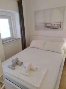 Katil atau katil-katil dalam bilik di Apartment in Povile 50835