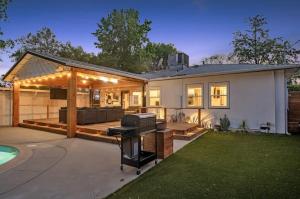 a house with a backyard with a grill and a pool at Lake Balboa Hideaway in Los Angeles