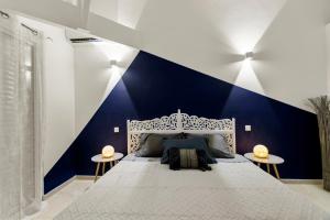 En eller flere senge i et værelse på Vue mer Ilet Pinel - Appartement 4p 1ch