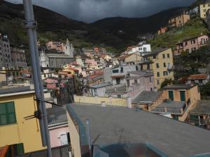 a view of a city with buildings on a hill at The Sunrise in Riomaggiore