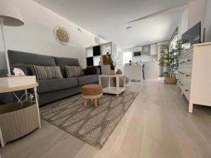 a living room with a couch and a table at Apartamento Victoria Deluxe in Fuente Obejuna