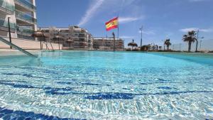 Bazén v ubytování Dunas Beach Apartment nebo v jeho okolí