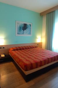 Postel nebo postele na pokoji v ubytování Hotel I Cedri