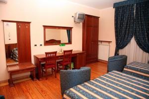 Posteľ alebo postele v izbe v ubytovaní Hotel Nizza