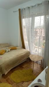 Postel nebo postele na pokoji v ubytování PANZIONERA Apartment Center