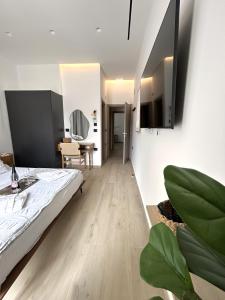 a bedroom with a bed and a dining room at Katikia in Línia