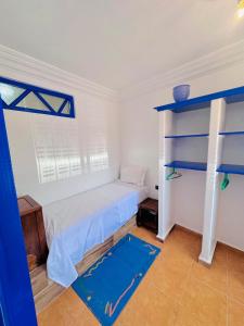 Rúm í herbergi á Spot vue sur mer pour les familles