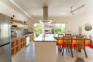 a kitchen and dining room with a table and chairs at 3060 - Bocana Beach Condo B2 in Valerio Martínez