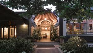 a house with an archway in the front of it at Deco Hotel in Perugia
