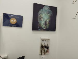 a picture of a statue on a wall at Fiore di Loto Rooms in Carini
