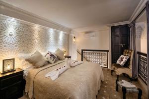 En eller flere senge i et værelse på Riad Star by Marrakech Riad