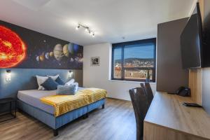 Televízia a/alebo spoločenská miestnosť v ubytovaní R73 Residences