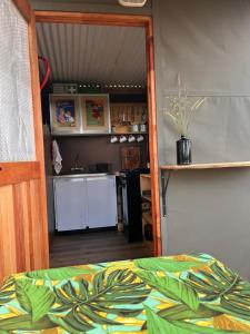 a room with a kitchen and a bed in a room at The Termite Mound - Termite Tented in Khwai +19 photos
