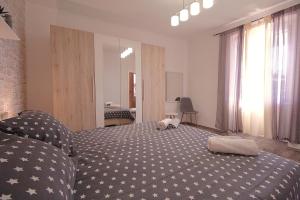 Postel nebo postele na pokoji v ubytování Apartments Mima