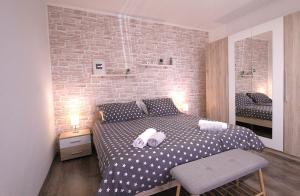 Postel nebo postele na pokoji v ubytování Apartments Mima