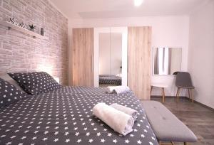 Postel nebo postele na pokoji v ubytování Apartments Mima