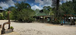 a statue of a giraffe in front of a building at Casa Jabalí Ecocchic in Tulum