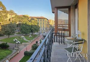 a balcony of a building with a view of a street at Central panoramic apartment in Montecatini Terme
