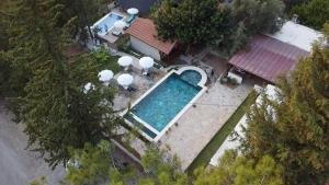an overhead view of a swimming pool next to a house at KiDRAK OTEL MONTENEGRO-1 in Faralya