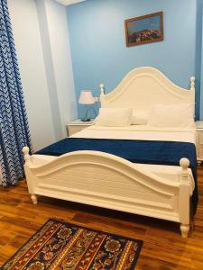 A bed or beds in a room at Tiba Rose hurghada