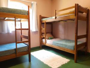 Postel nebo postele na pokoji v ubytování Jungla Hostel
