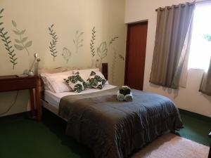 Postel nebo postele na pokoji v ubytování Jungla Hostel