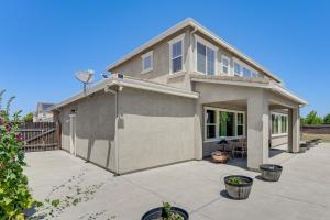 a house with a large patio in front of it at Family Home with Patio and Fenced Yard in Brentwood in Brentwood