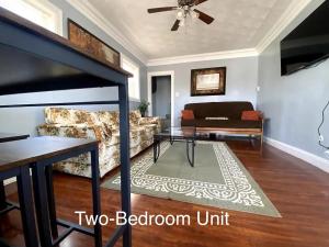 a living room with a couch and a table at Derby City Getaway in Louisville