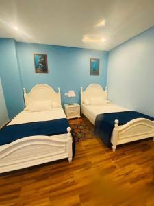 A bed or beds in a room at Tiba Rose hurghada
