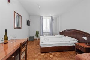 Postel nebo postele na pokoji v ubytování Minerva Hotel