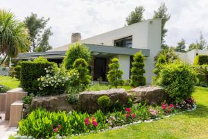 A garden outside Sani Green Villa