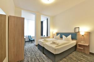 Postel nebo postele na pokoji v ubytování Hotel Meereseck